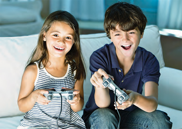 Children playing on a game console