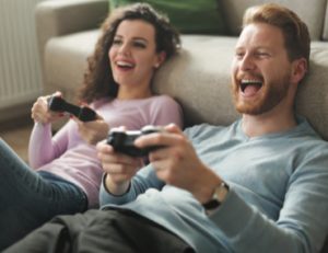Couple playing a console game